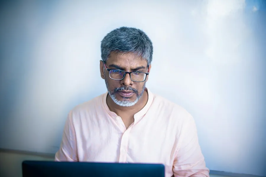 Senior engineer reviewing code
