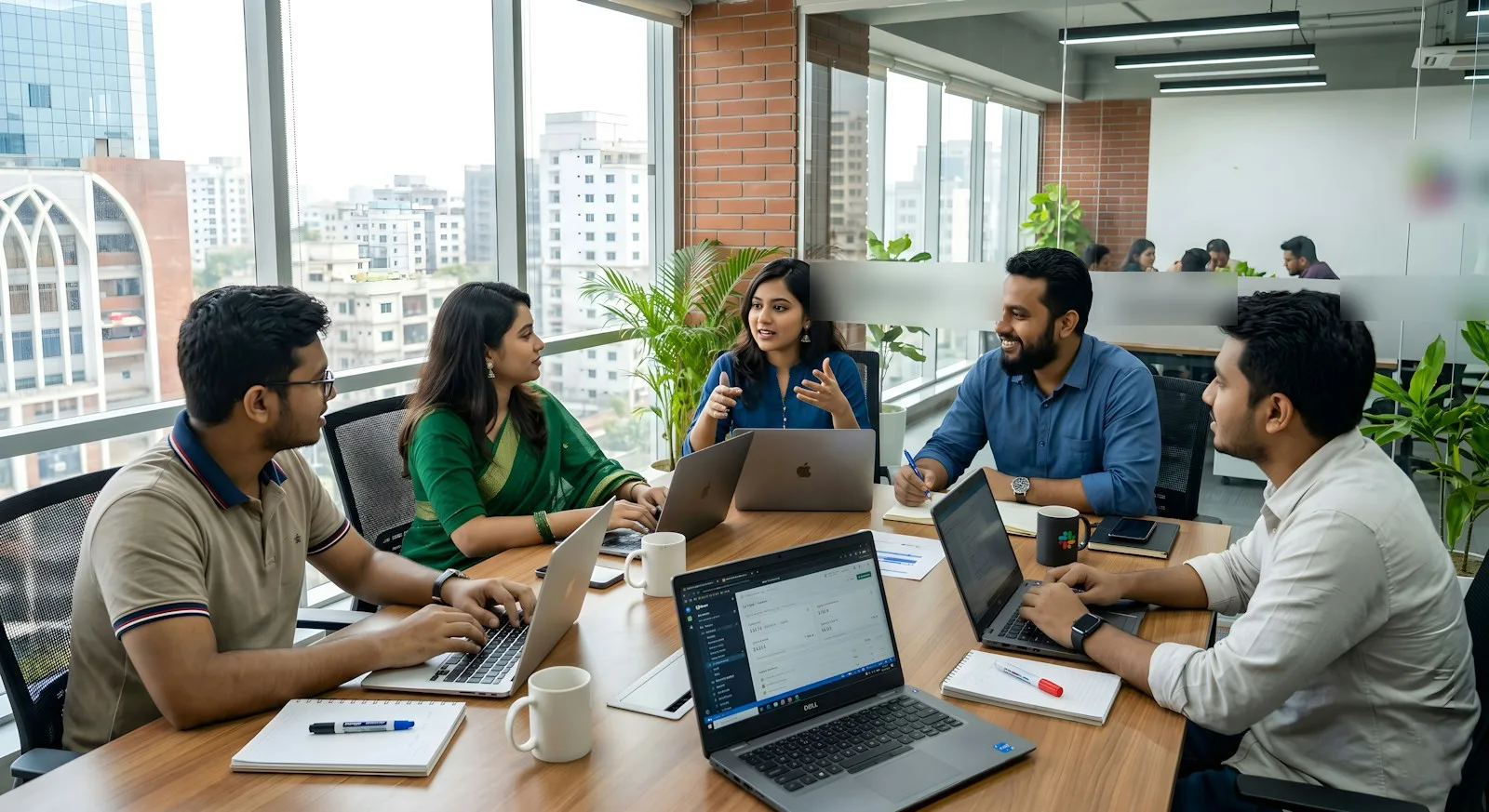 Indrashikha engineers collaborating around a table
